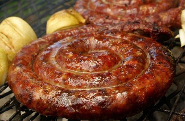 A coil of boerewors sausage on the braai