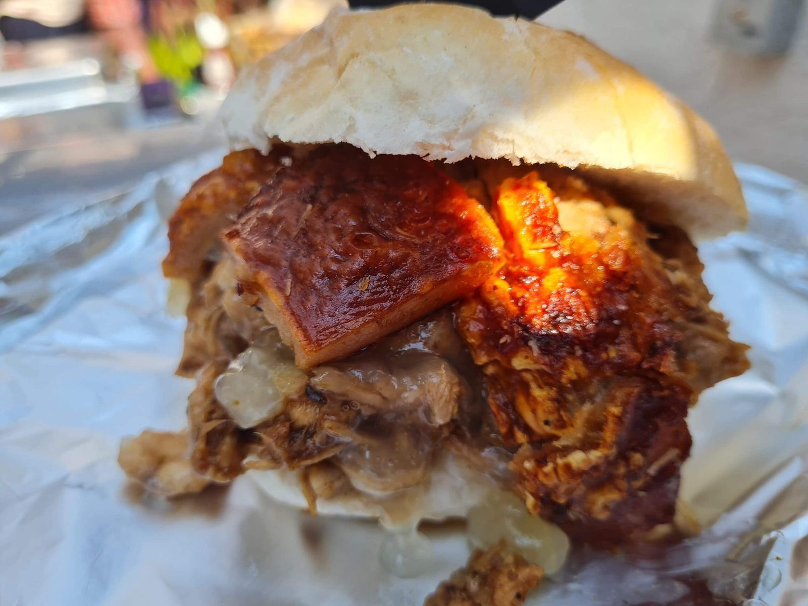 Hog roast roll piled with pork and crackling